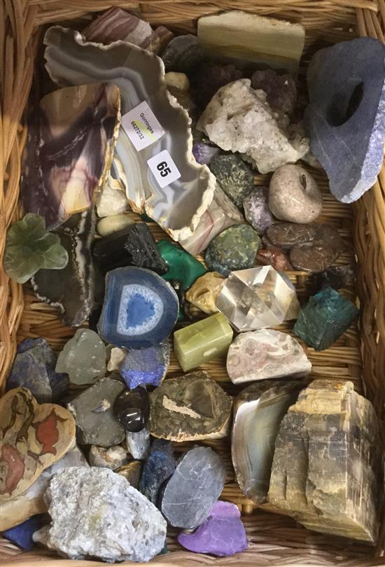 Large collection of specimen minerals including agate, malachite, etc, in a wicker basket